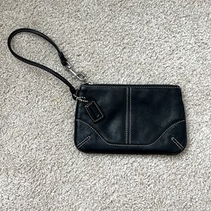Coach black mini wristlet with signature C interior